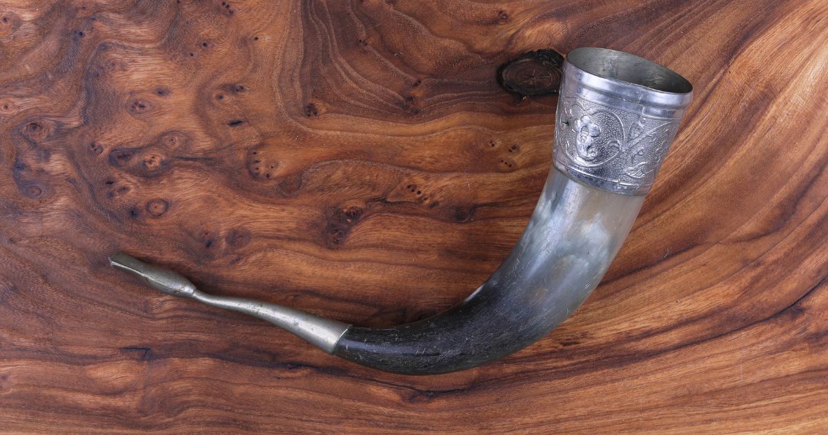 A bull horn covered in silver for drinking honey or wine